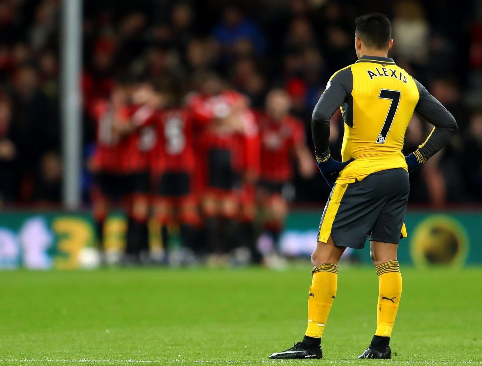  Sanchez cuts a forlorn figure as Bournemouth celebrate their second goal