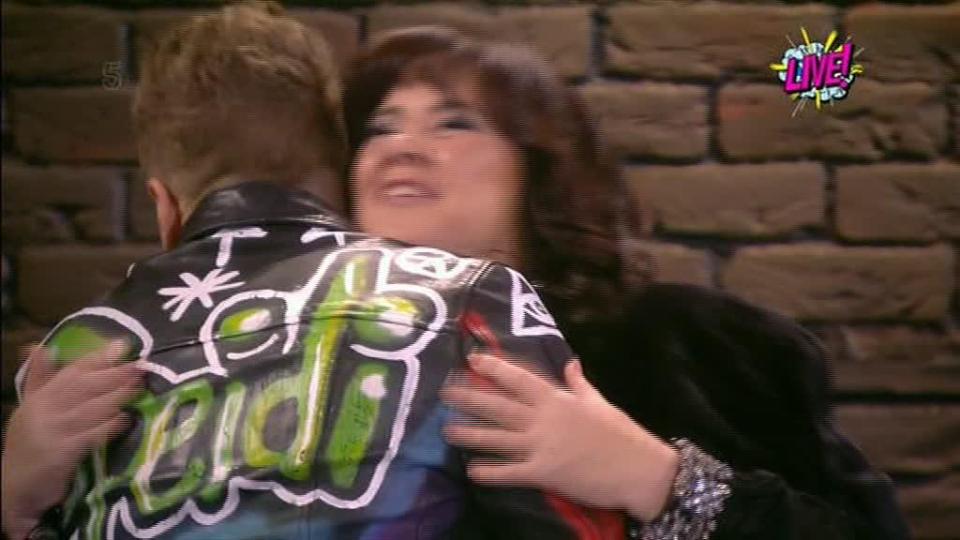  Coleen greeted Spencer with a hug