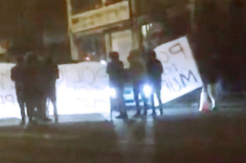  The shooting has sparked protests in Huddersfield, with people holding banners reading 'Police don't murder'