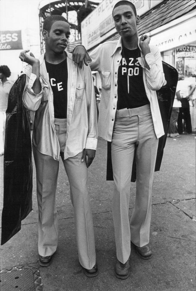  Men show off their flared trousers at the tourist attraction of Coney Island in 1976