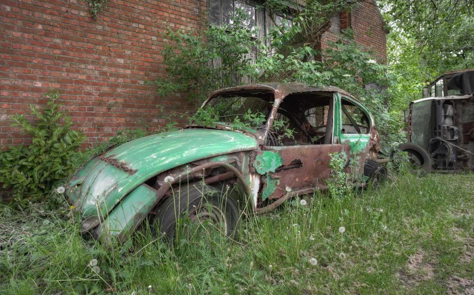  A VW Beetle's distinctive shell was discovered abandoned outside of a brick building