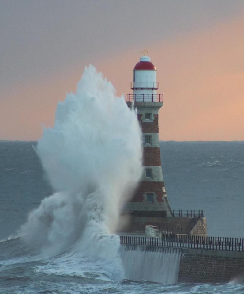  Huge waves smashed against the Roker Pier lighthouse in Sunderland this morning as the sun rose