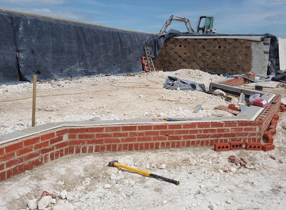  A team of volunteers including prisoners helped build the unusual house, with some mistakes along the way