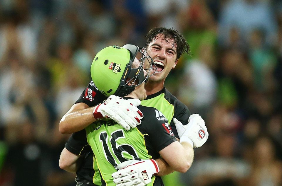  Morgan is congratulated by teammate Pat Cummins after his heroics