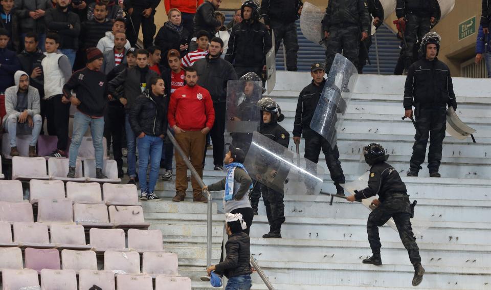  Supporters clashed with riot police in the stands during friendly