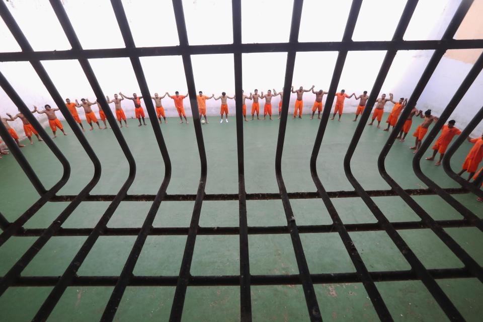  Inmates pray before a soccer match in the Pedrinhas Prison Complex