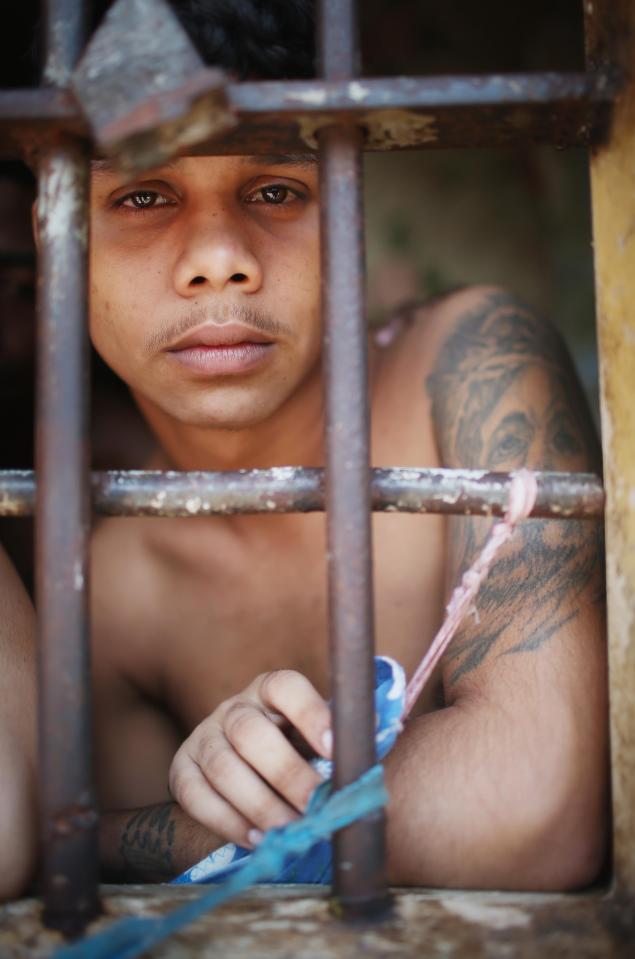  A young inmate stands in his cell at the jail which has seen several riots over the years