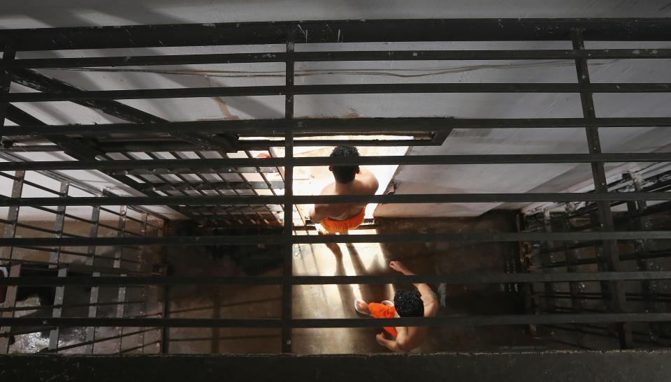  Inmates walk from their cells towards a recreation area in the Pedrinhas Prison Complex