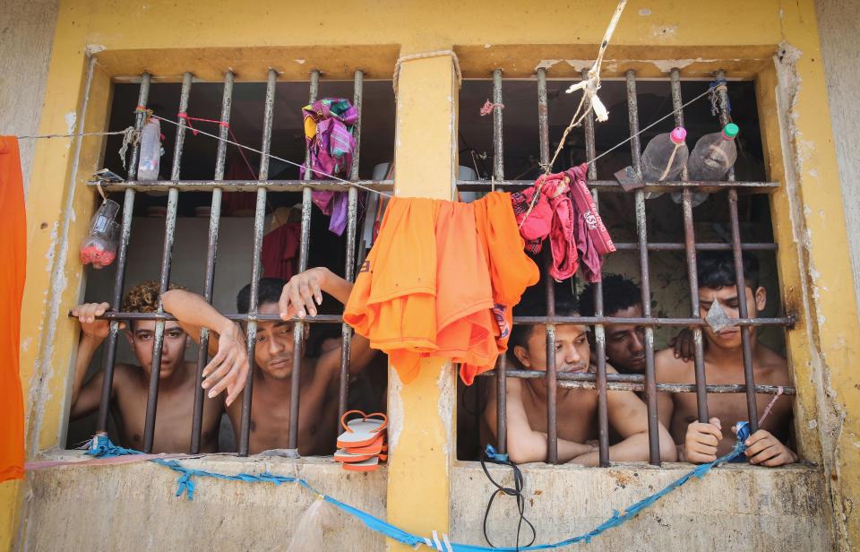  Inmates stand in their cell in the Pedrinhas Prison Complex, the largest penitentiary in Maranhao state