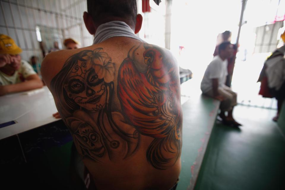  An inmate shows off his tattoo in the Anisio Jobim penitentiary complex in Manaus, Brazil