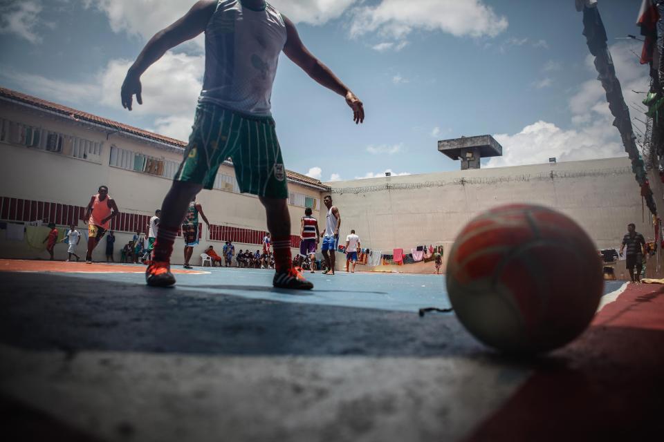  Inmates play soccer in the overcrowded Puraquequara prison in Manaus, Brazil, which currently is at double capacity