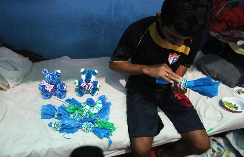  A detainee makes creations from plastic bags in the overcrowded Desembargador Raimundo Vidal Pessoa penitentiary