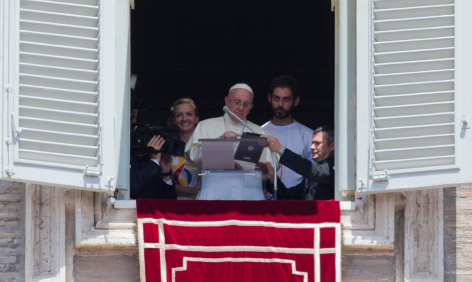  Pope Francis uses an iPad to sign himself up a World Youth Day in Poland, during the Angelus noon prayer in July2015