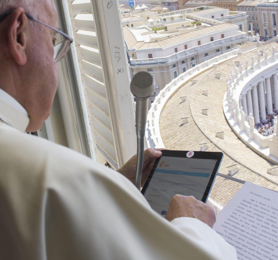  The pope reads from an iPad with a sticker over the camera