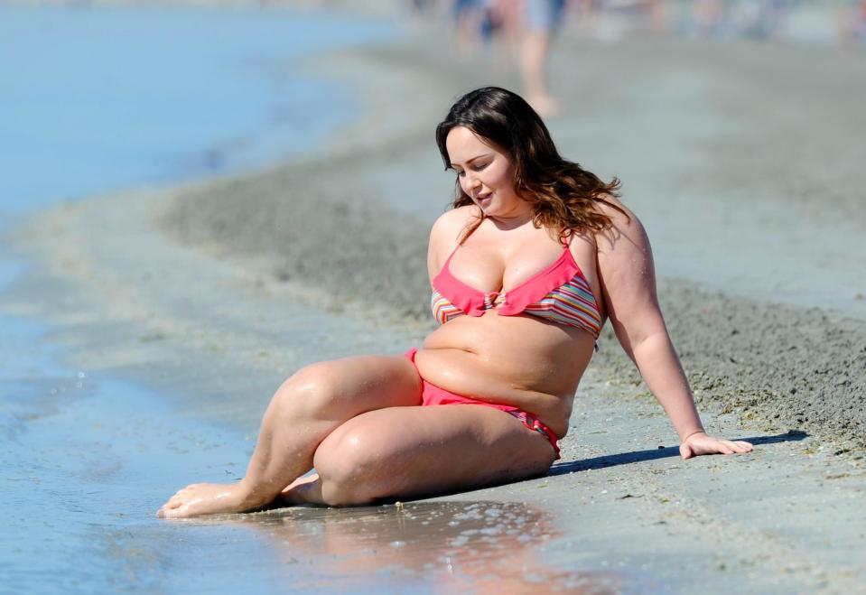  She looked deep in thought as she sat on the sand