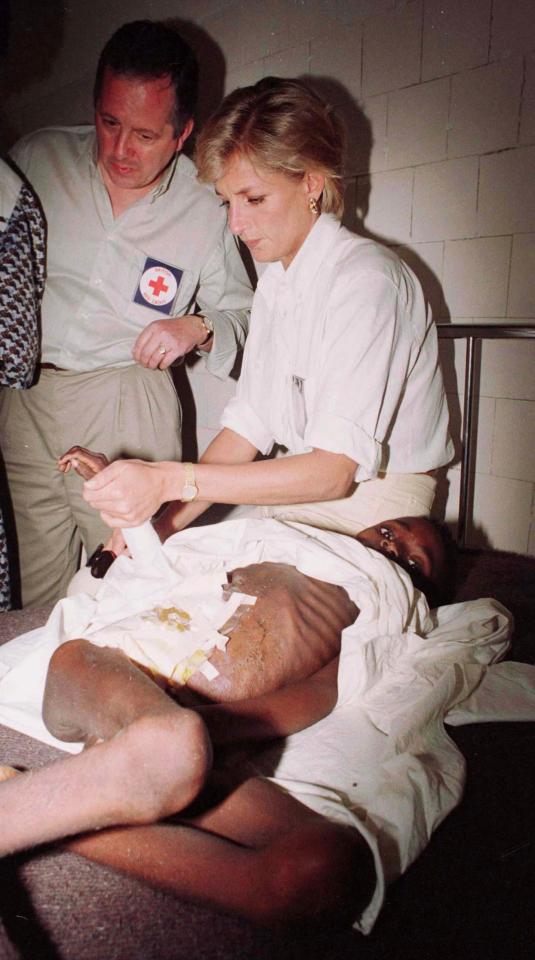  Di, pictured here comforting the victims of a landmine in a hospital, helped to secure an anti-landmine agreement, signed just months after her death in 1997