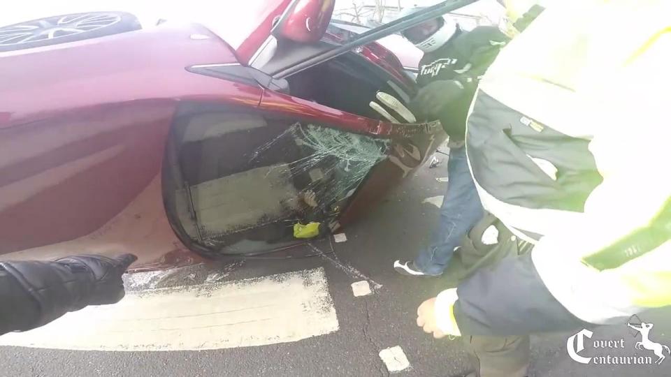  A motorcyclist stopped to find the elderly man stuck inside the upside-down vehicle