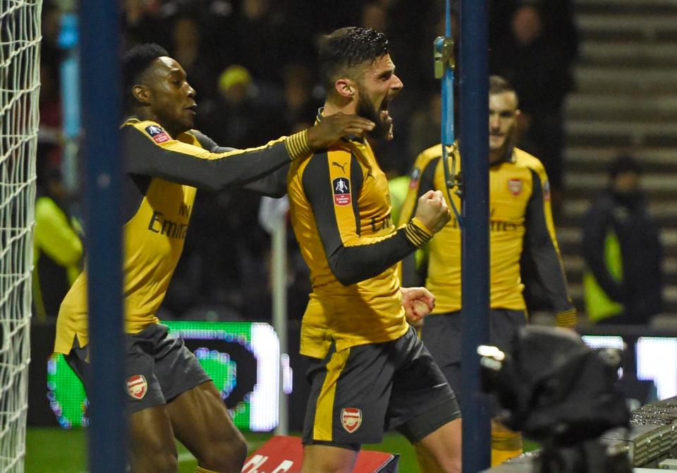  Giroud celebrates in front of the visiting supporters