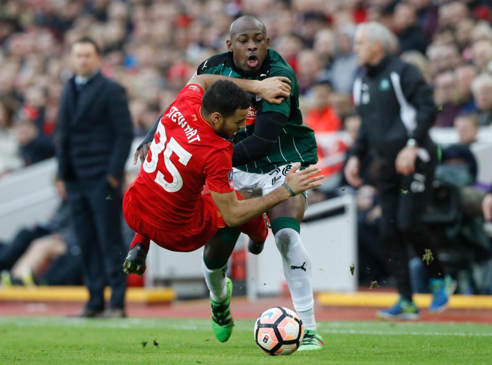  Kevin Stewart comes off worse in his clash with Plymouth striker Paul Arnold Garita