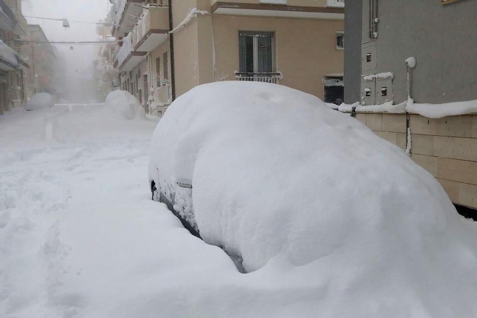  Streets lie deserted as several feet of snow covers cars in Santeramo, Italy