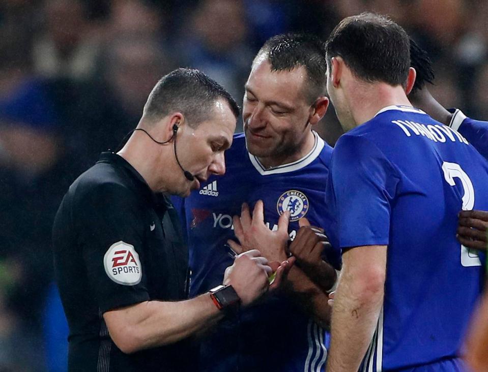  Chelsea captain John Terry pleads his innocence to referee Kevin Friend