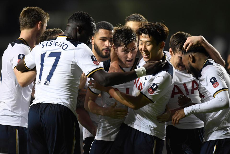  First goalscorer Ben Davies is mobbed by his Spurs team-mates