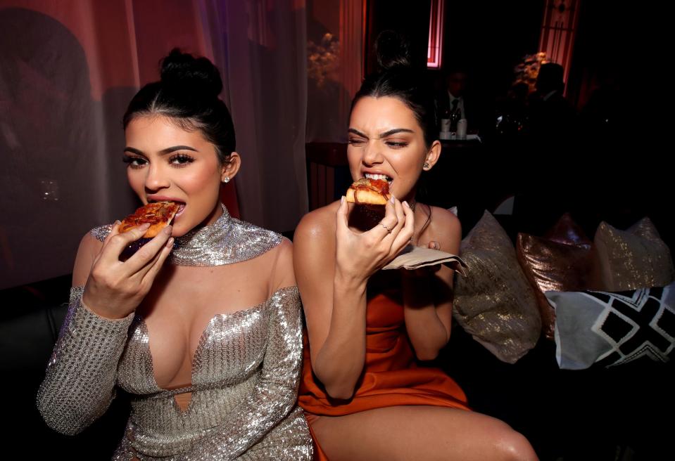  The sisters were later seen wolfing down pizza at the party