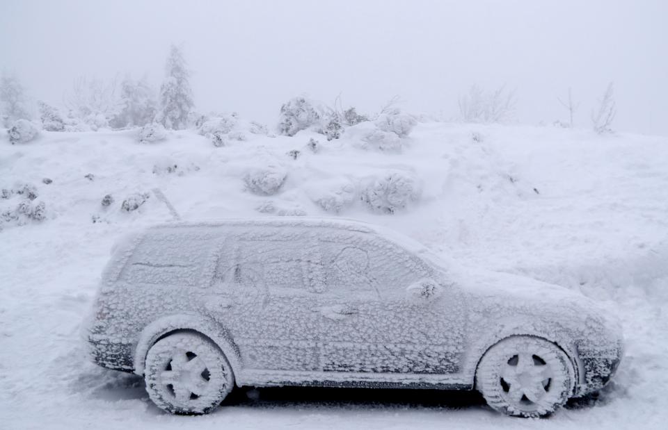  A car is completely covered in ice as temperatures dropped as low as -34.6C