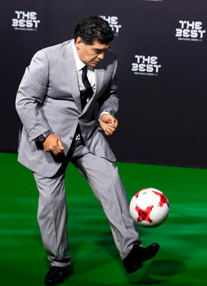  Argentina legend Diego Maradona messes about with a football while players arrive at the ceremony