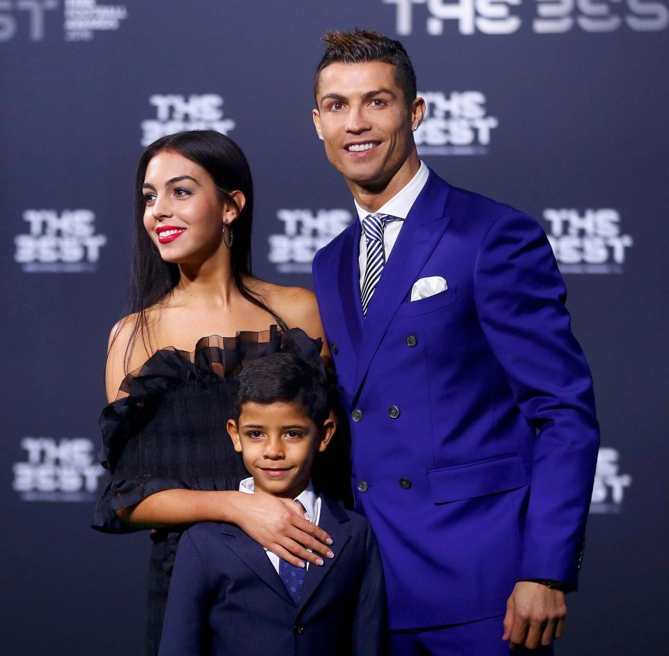  Cristiano Ronaldo, Cristiano Jr and a mystery woman pose on the red carpet before the award ceremony