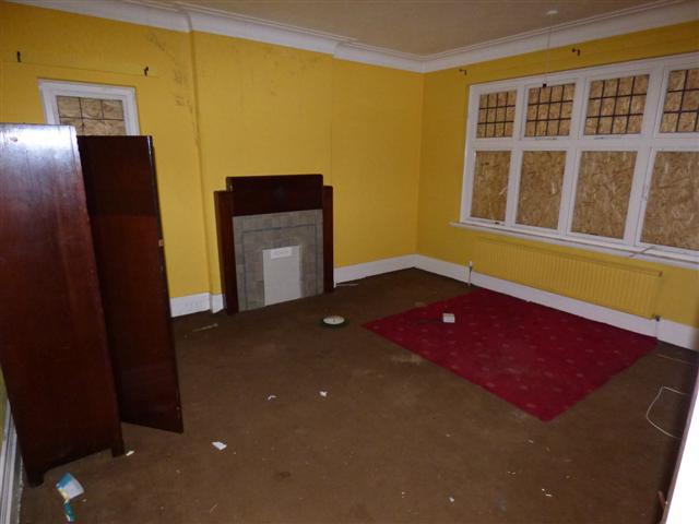  Windows and fireplaces are boarded up in the sizeable home that could be yours for a bargain £80,000