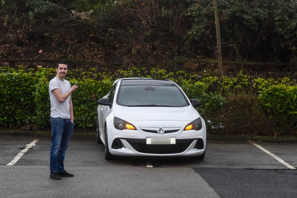 Luke stands beside his beloved car, which he won't let other motorists get close to with his selfish parking technique