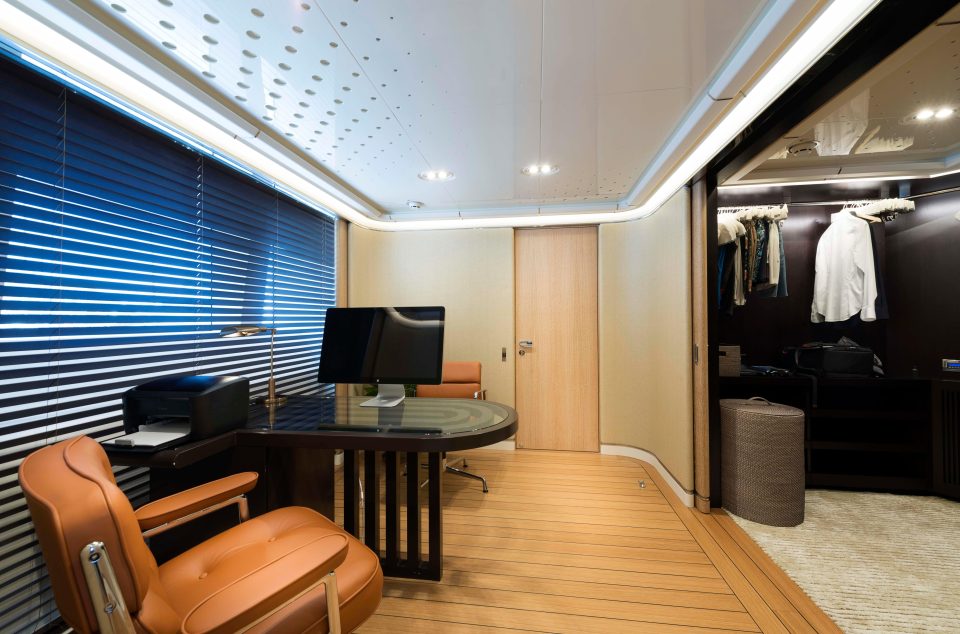  The lavish yacht, with its distinctive wooden decking, has a master cabin with a bathroom, office and dressing room, pictured right, which takes up an entire floor