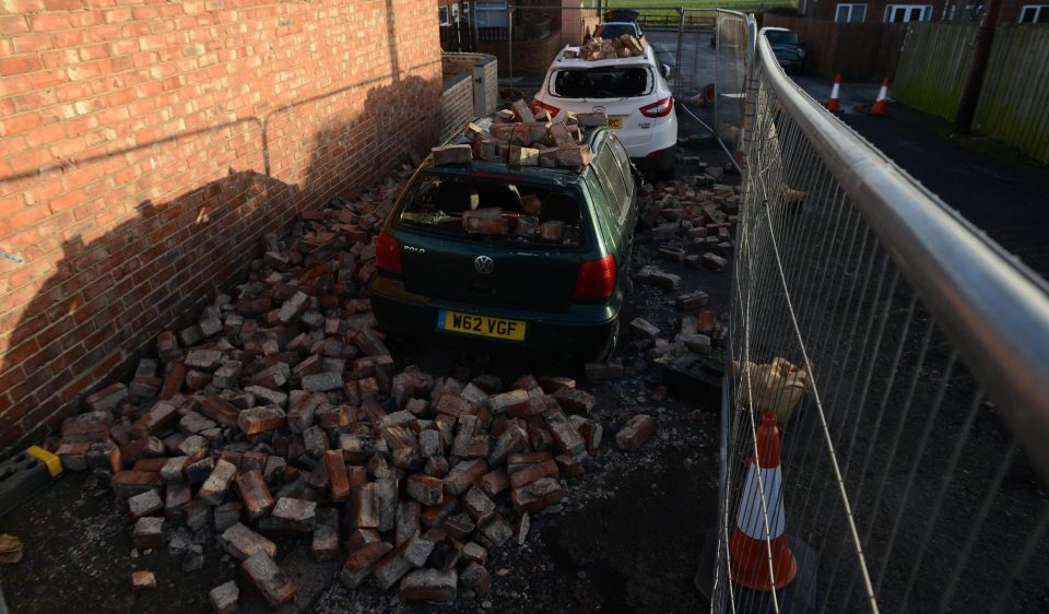  The scene in Ouston, County Durham, where vehicles have been damaged by falling bricks after strong overnight winds caused the end of a house to partially collapse