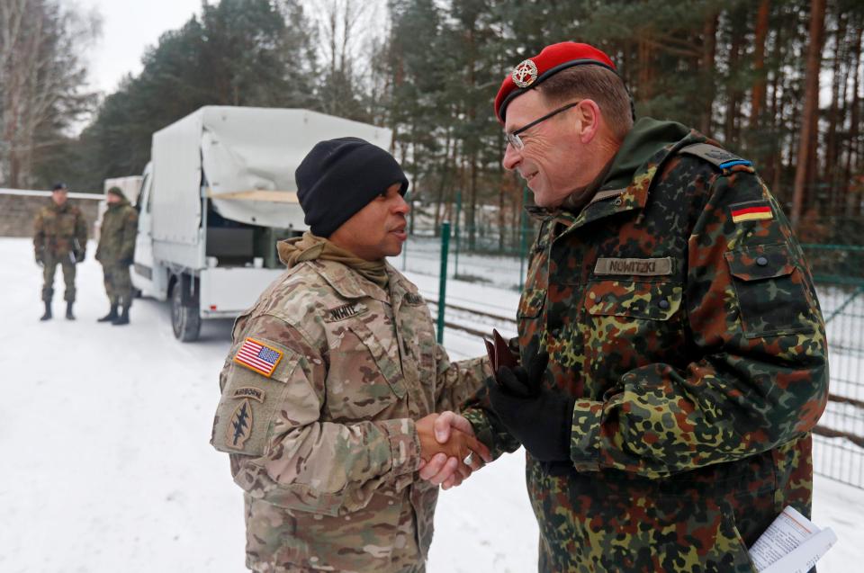  German Lieutenant colonel Uwe Nowitzki, right, meets US Sergeant Major Montego White outside the Germany army compound in Brueck