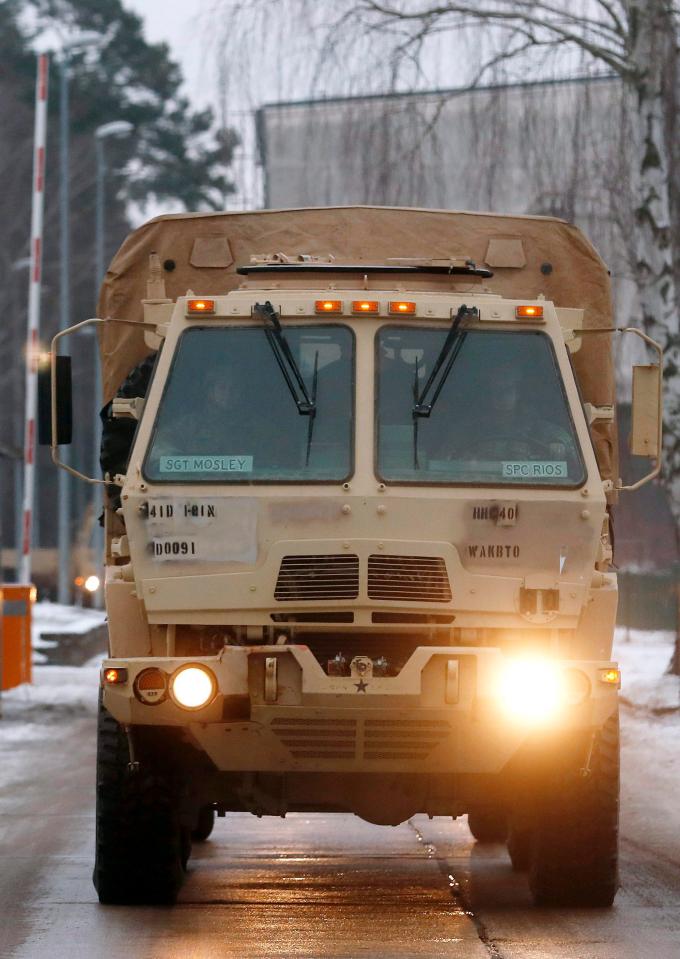  The front windows of a enormous US military truck read 'Sgt Mosley' and 'SPC Rios'