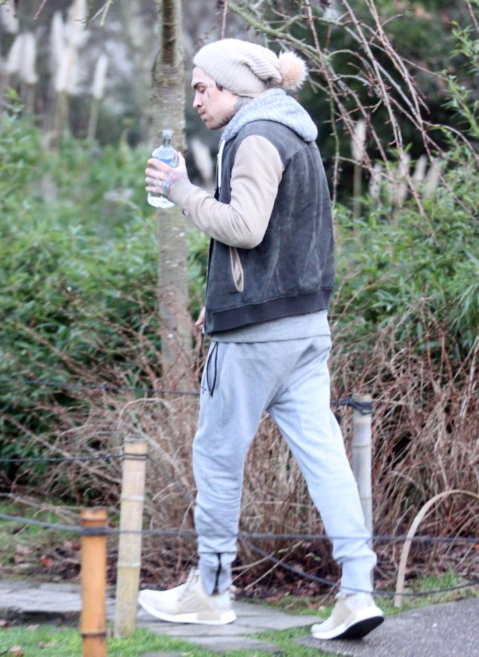  Marco carried the bottle round before lying down on the bench