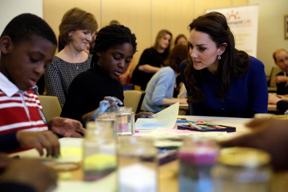  The Duchess speaks with children at the charity, which supports families and educates professionals when a baby or child of any age dies or is dying, or when a child is facing bereavement