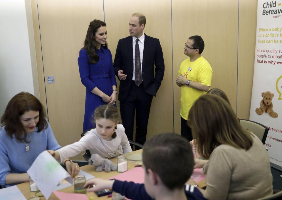  The Duke and Duchess speak with staff at the bereavement centre as children make memory jars