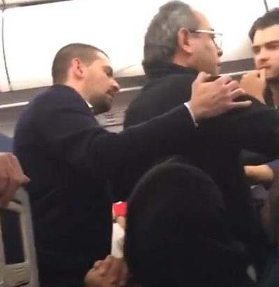  The older passenger is seen arguing with the younger man