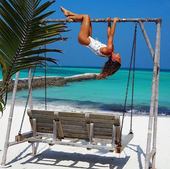  Louise shared a snap of herself hanging upside down