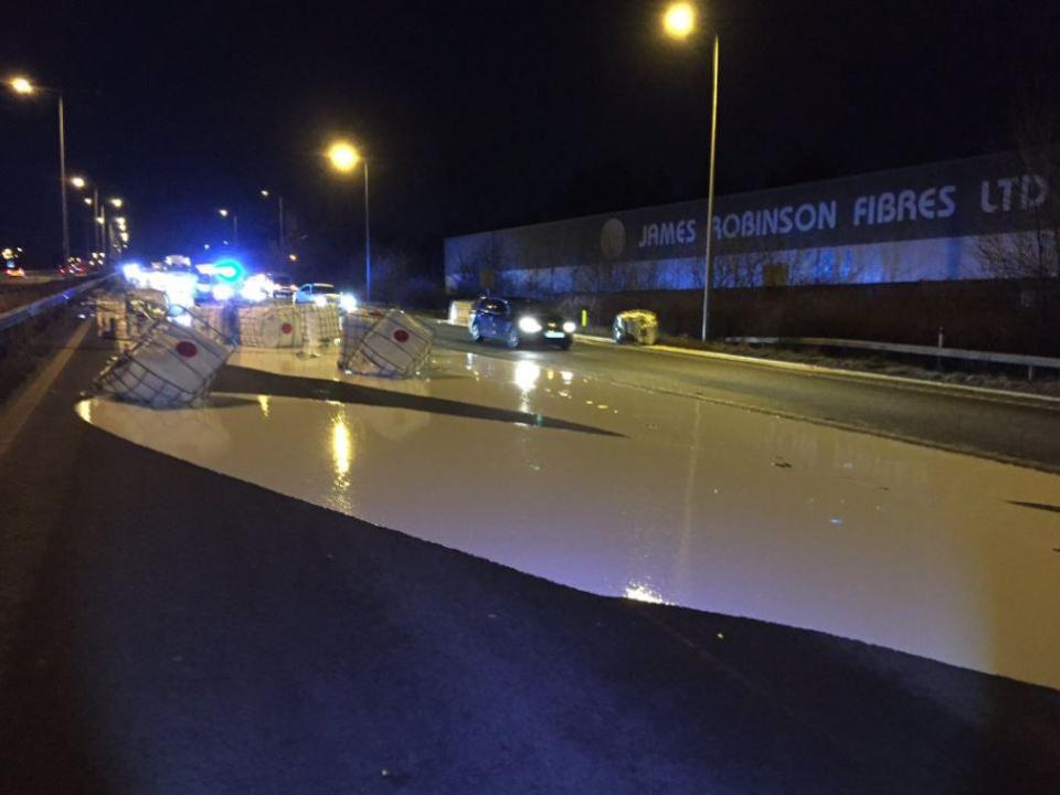  A motorway has been closed after a lorry spilled 12,000 litres of white paint in a collision