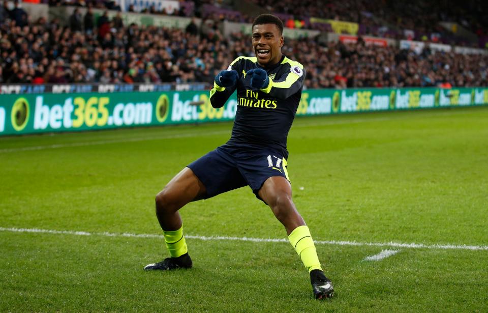  Alex Iwobi's looped high into the air and crept under the bar - leaving Lukasz Fabianksi with no chance