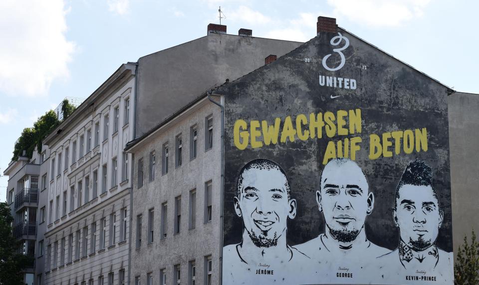  A painting of the three Boateng brothers, football player Jerome Boateng, musician and football player George Boateng and football player Kevin-Prince Boateng (left to right) with a slogan reading 'Grown on concrete' is pictured at a house wall in Berlin, Germany