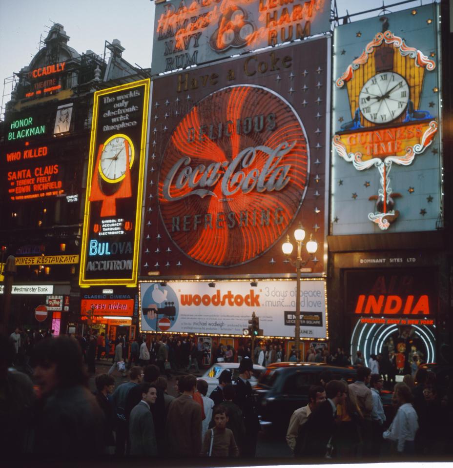  Coca-Cola ads sit next to Honor Blackman's name in lights at the Piccadilly theatre in 1970