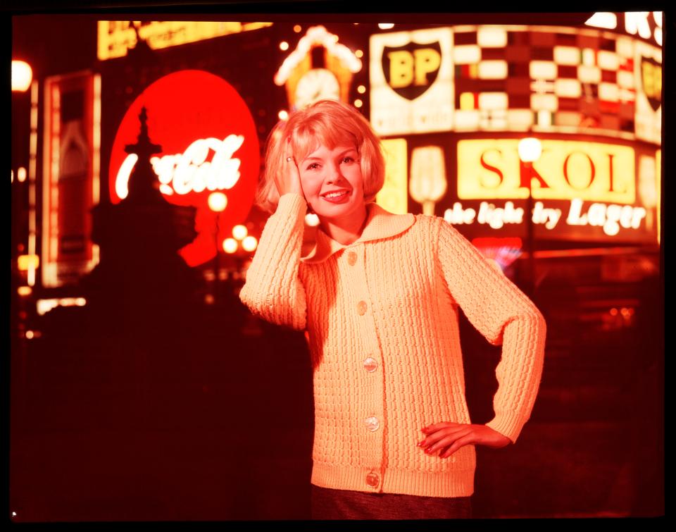  A tourist is snapped in front of the iconic boards in the 1950s