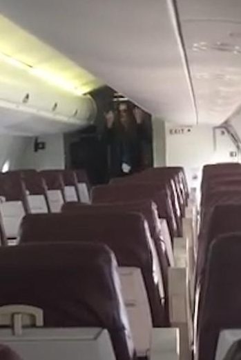  She can be seen performing the complete safety routine to an empty plane