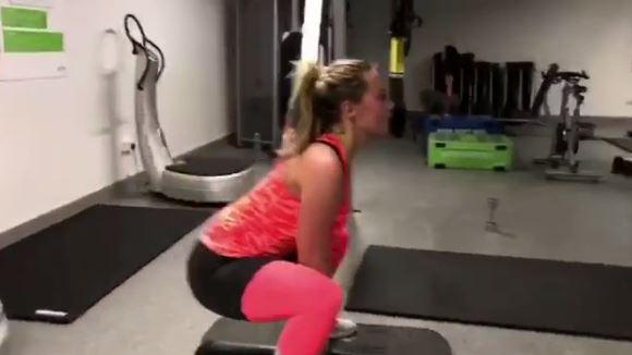  She straddled two Step blocks for her kettlebell session