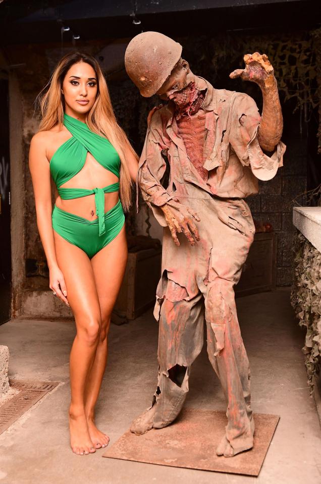  Geordie Shore's Zahida wowed in her busty green halterneck with matching pants as she stood next to a scary character