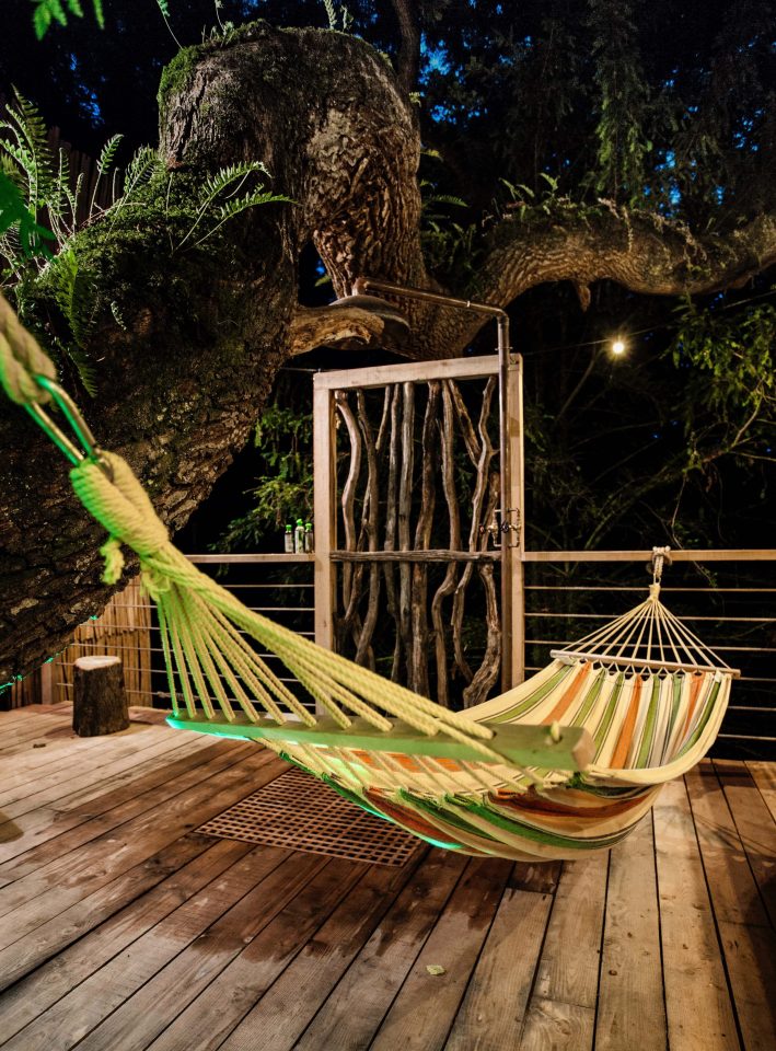  A hammock next to the outdoor shower allows guests to relax in the open air